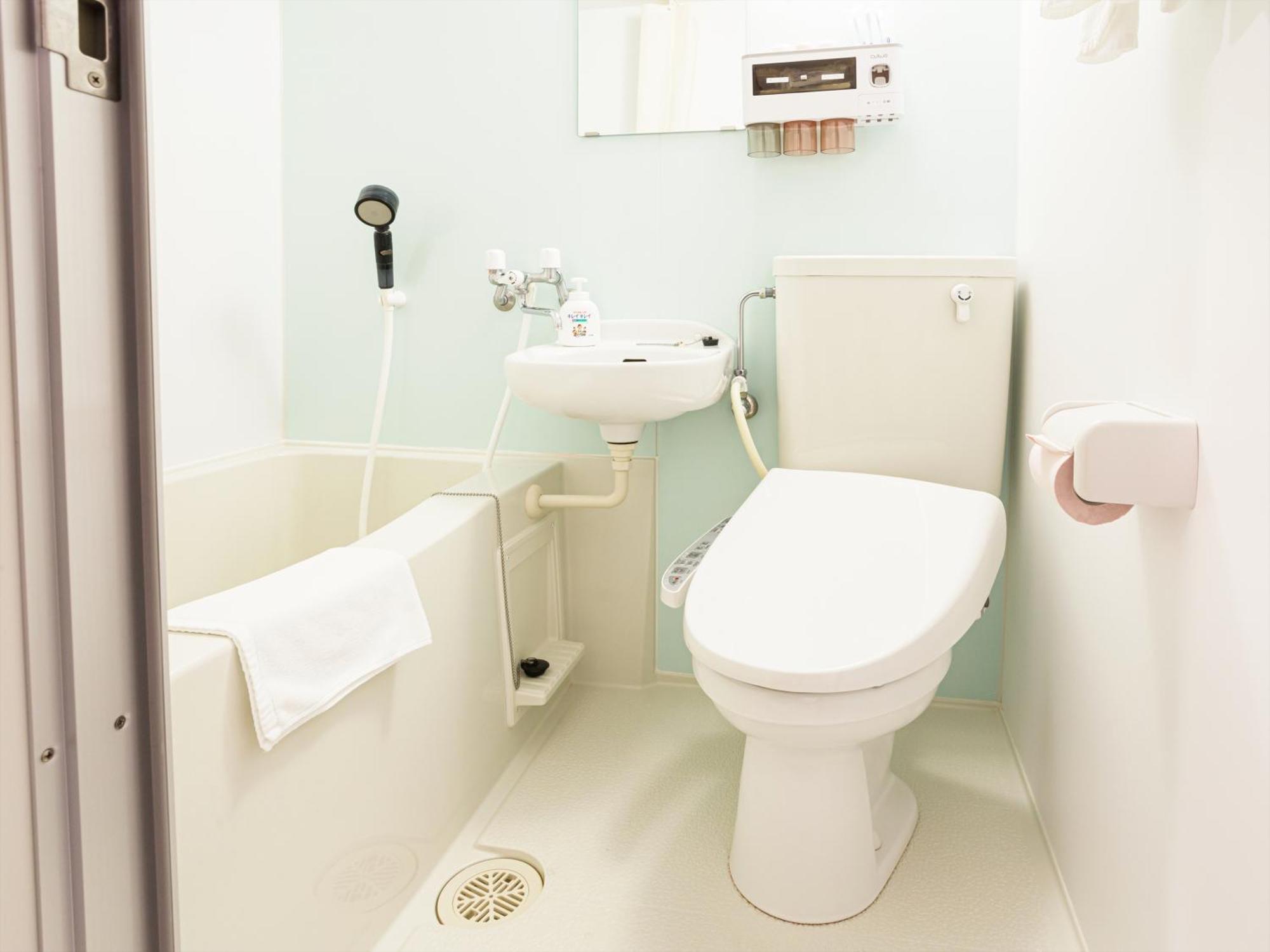 かりゆしコンドミニアムリゾート那覇スカイリビングホテル旭橋駅前 Naha Habitación foto