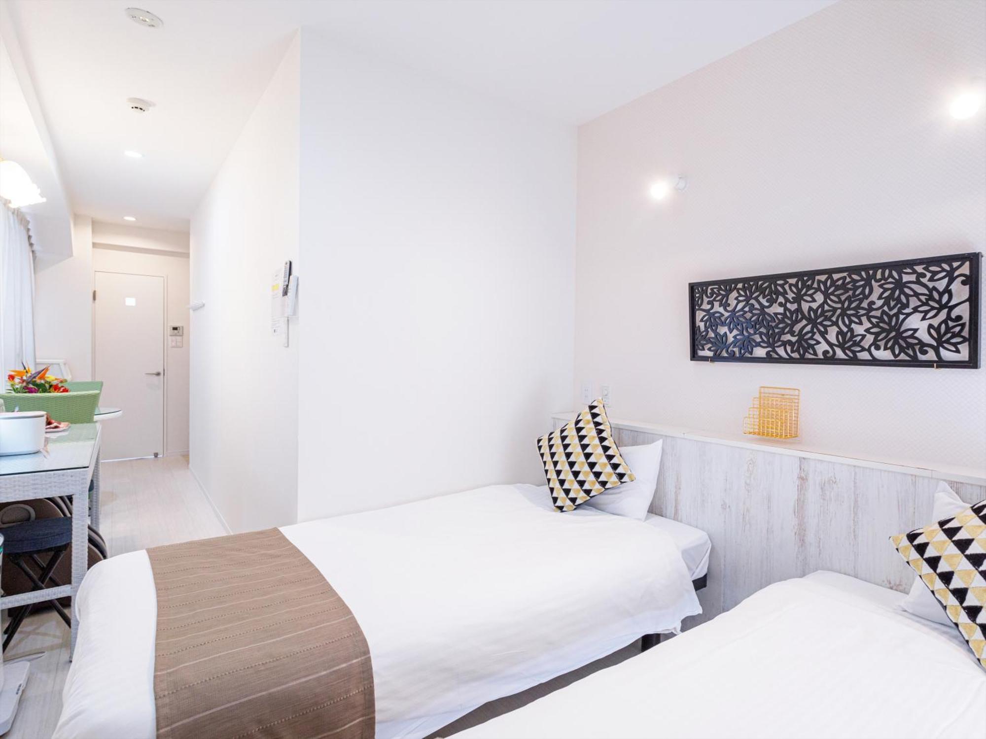 かりゆしコンドミニアムリゾート那覇スカイリビングホテル旭橋駅前 Naha Habitación foto